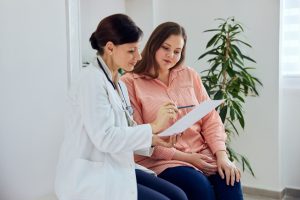 Doctor Speaking with Patient