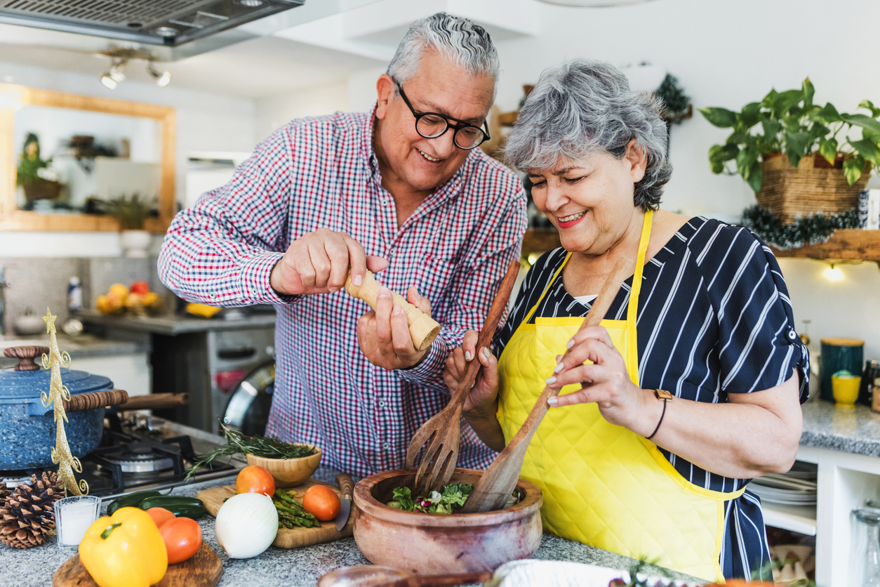 Senior couple making dinner